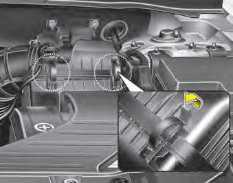 1. Loosen the air cleaner cover attaching clips and open the cover.